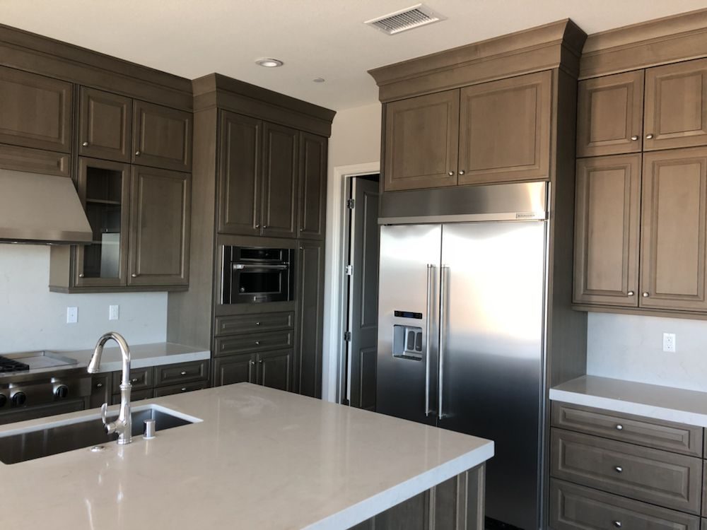Finished kitchen with built-in stainless refrigerator installed by A Plus Appliance Care